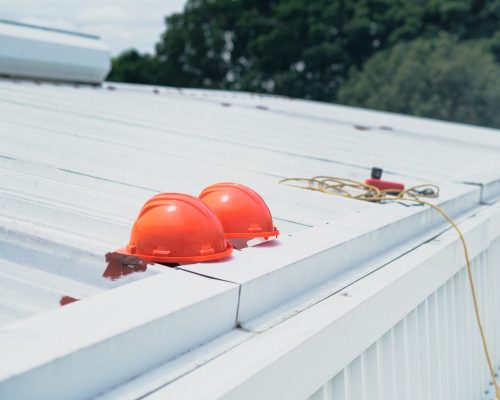 hard hats near roof gutter
